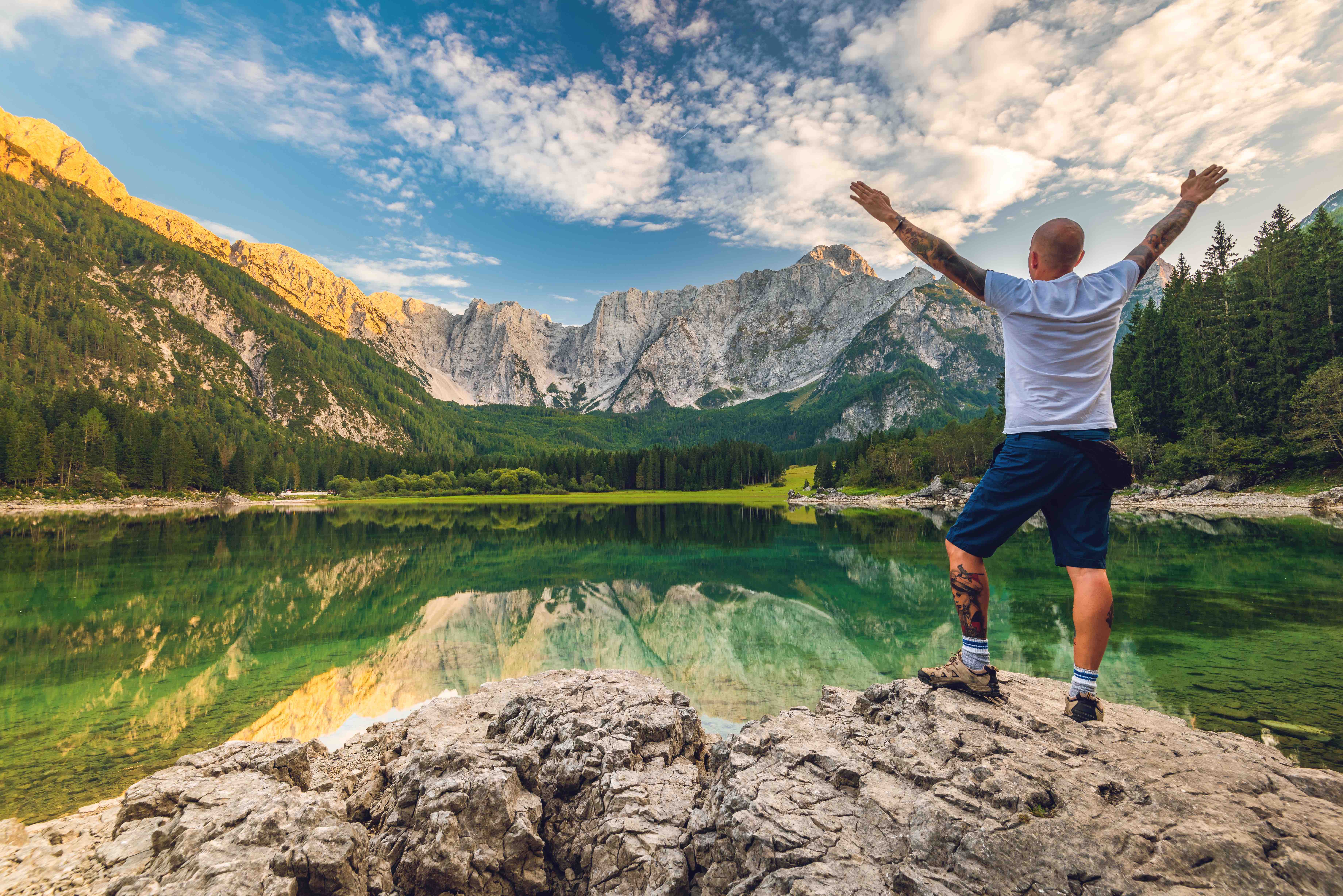 Solo Traveller Adventure Man Standing at Beautiful Alpine Lake